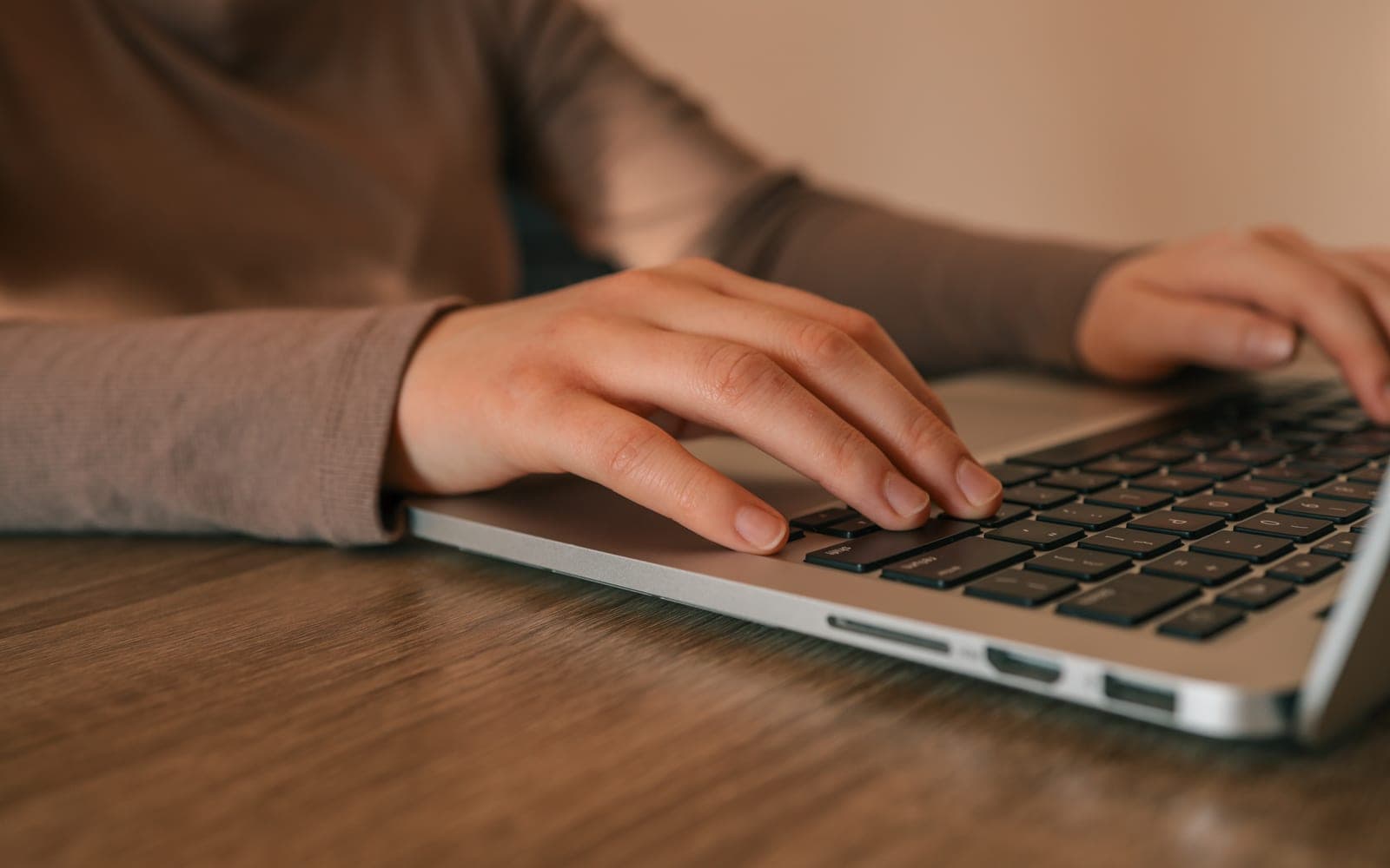 A shopper checking an online shop's details in public records on a laptop
